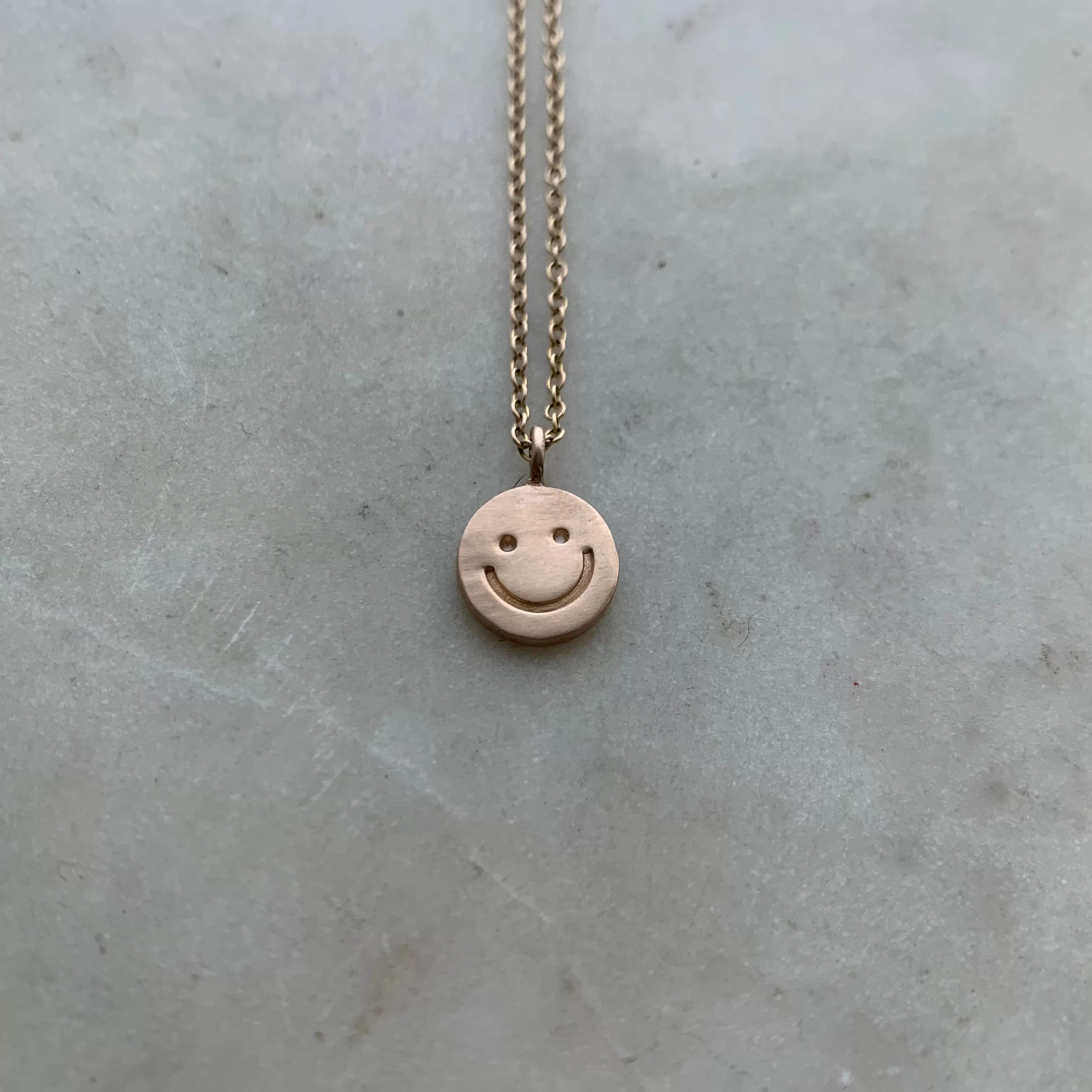 HAPPY FACE PENDANT