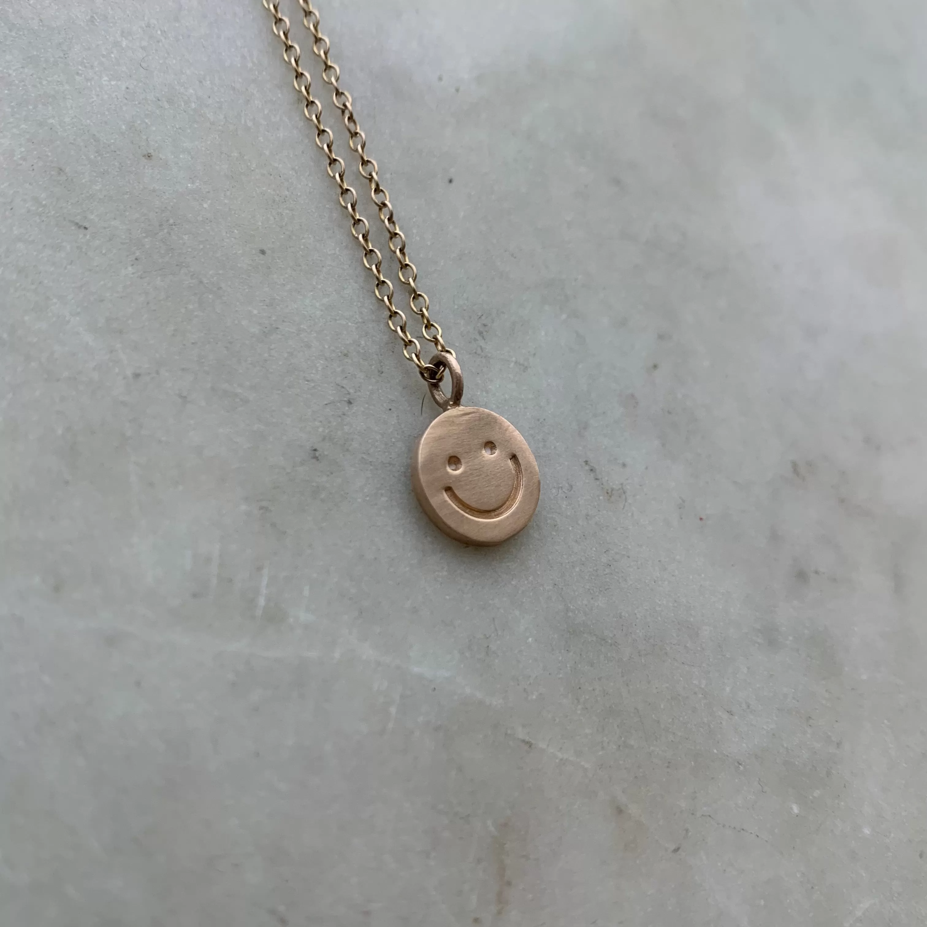 HAPPY FACE PENDANT